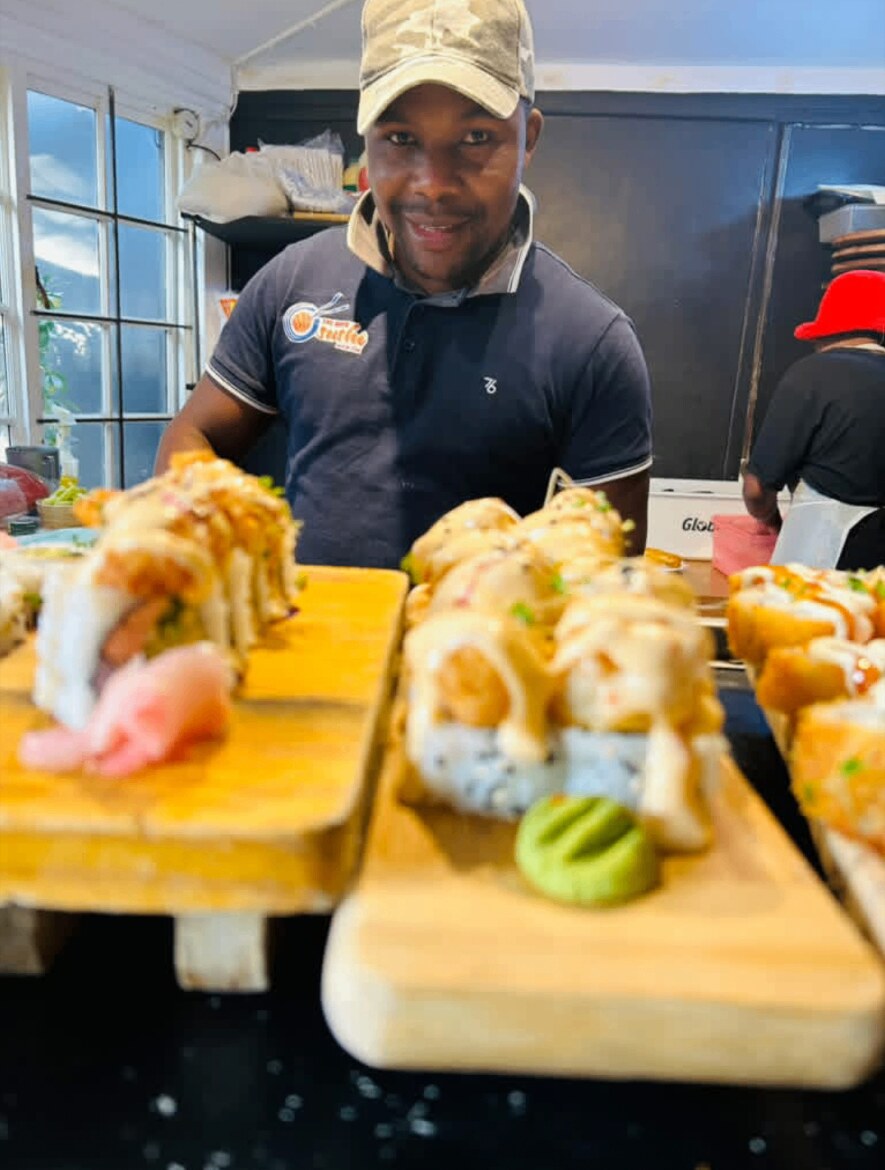 Chef plating sushi